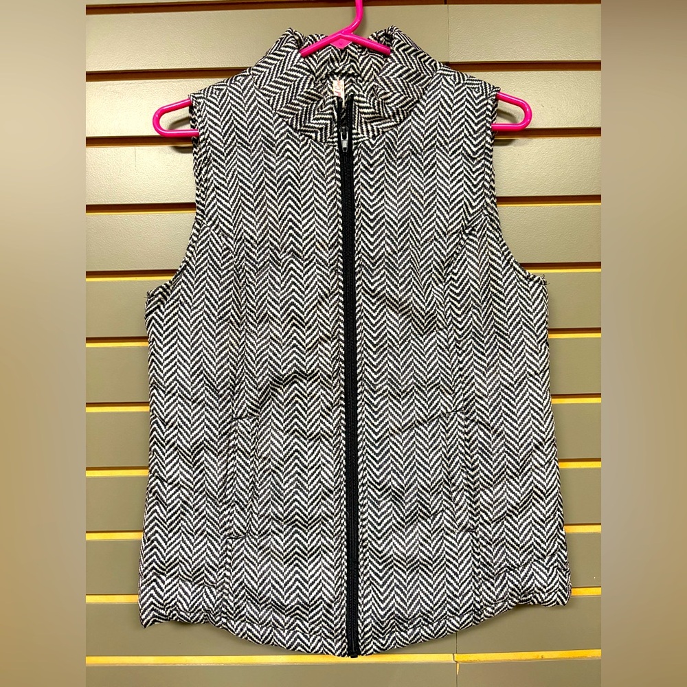 Puffy zippered vest, women’s size S, black/white chevron pattern.